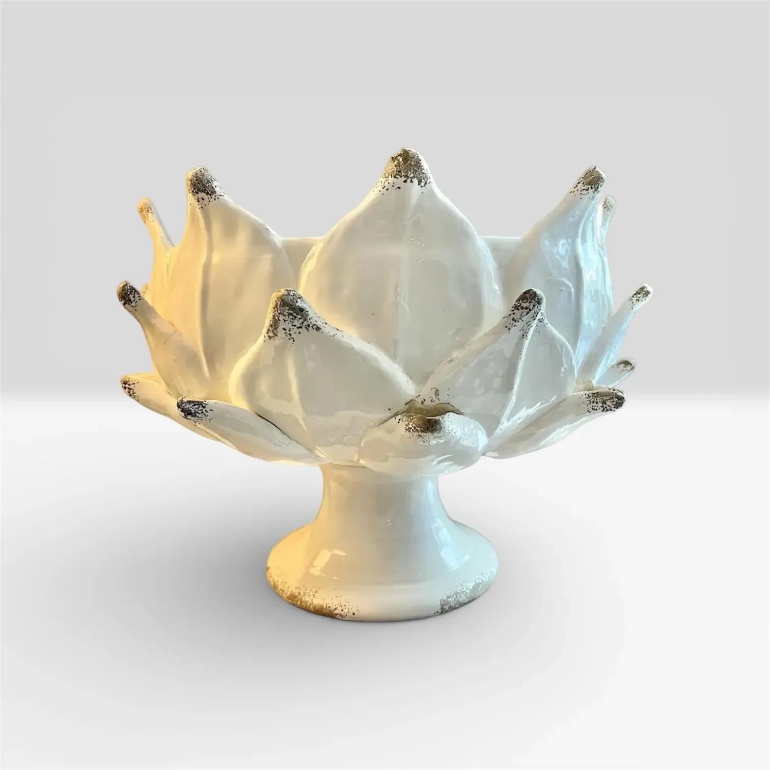 Heirbloom Studio off-white ceramic artichoke pedestal bowl with rustic distressed petal tips for elegant home decor.